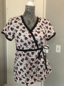 Koi scrub top size Small. New with tags. Heart print