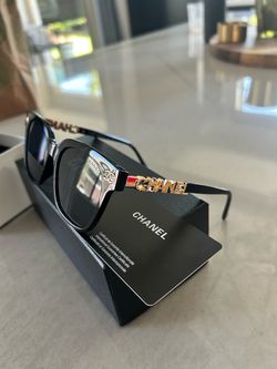 Chanel Black Sunglasses with Gold Letter Arms