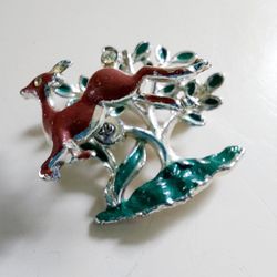 1.5" Enamel Deer on a Coiled Spring Jumping over a Tree Silver Toned Lapel Pin Brooch with Crystal Accents in his tail and eye. No markings. Pre-owned