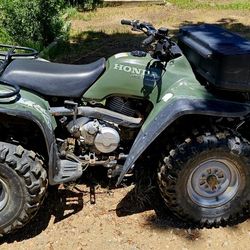 Honda fourtraxx 4x4, with plow and rack.
