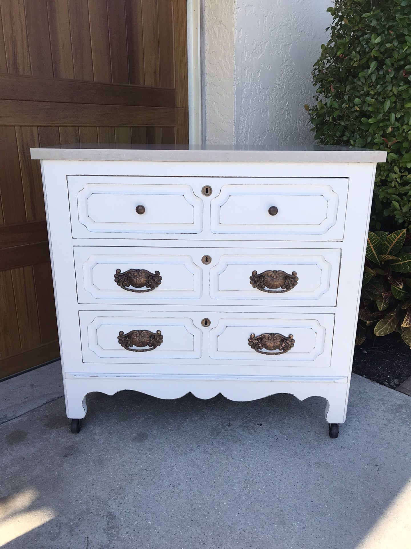 Three Drawer Dresser With Quartz Top And Casters