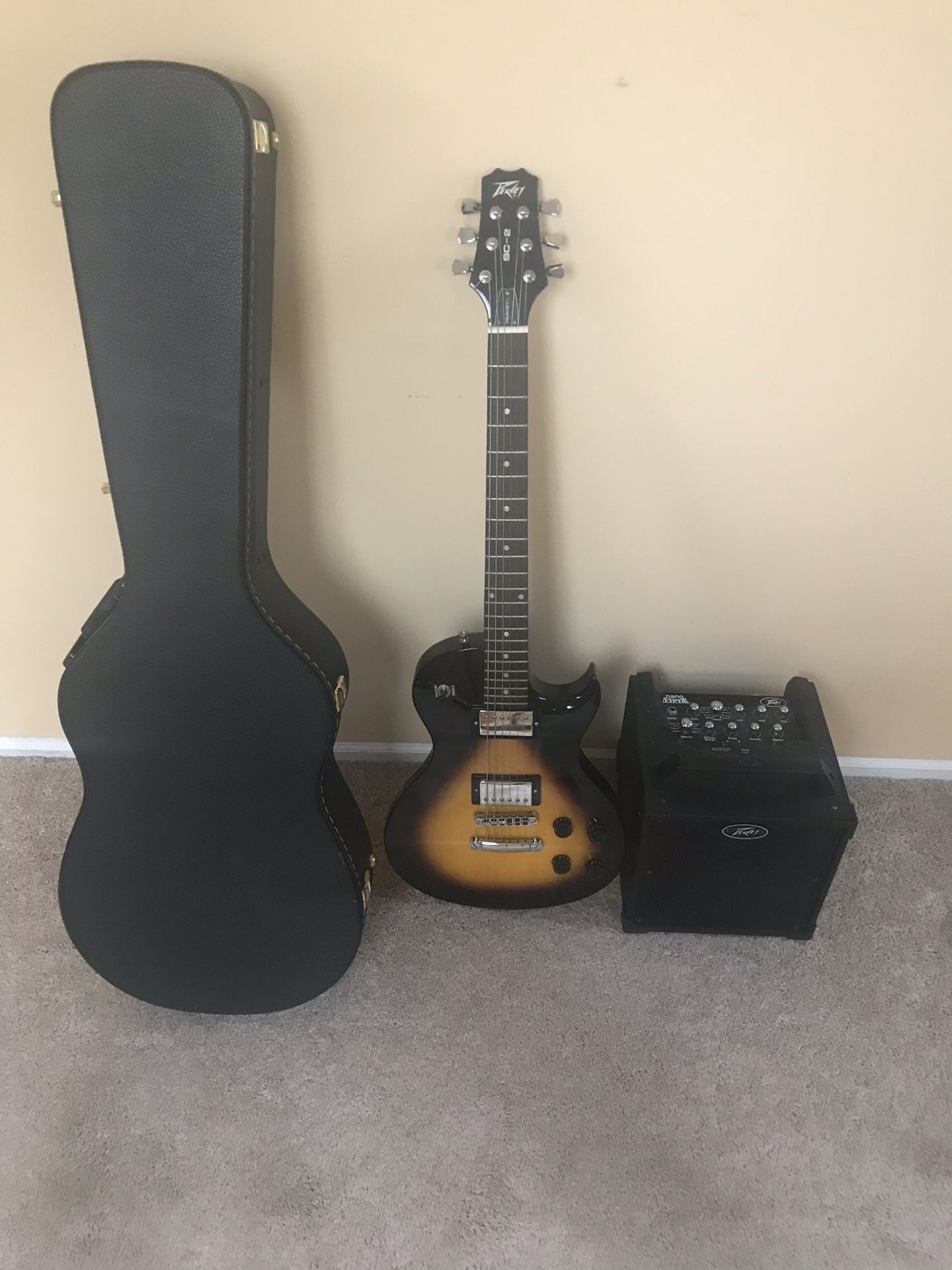 Peavey SC-2 Single Cut Series guitar, hard case and Peavey Nano Vypyr amp