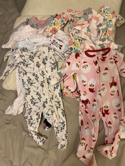 Seven 6 -9 months footed onesies