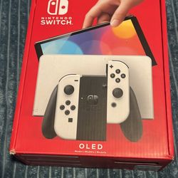 NINTENDO SWITCH OLED IN BOX.