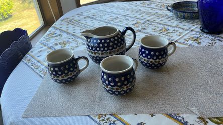 Polish pottery pitcher and three mugs