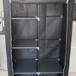 Extra Closet Organizer, With Shelves In A Pole To Hank Clothes And If You’re Not Using It, You Could Take It Apart $20