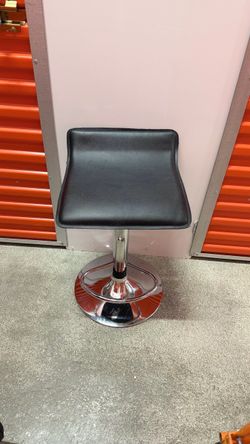 Set of 4 adjustable bar stools for sale.