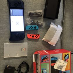 Nintendo Switch Oled in excellent condition with one game (Monster hunter) and screen protector