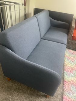 Blue couch, folds into bed
