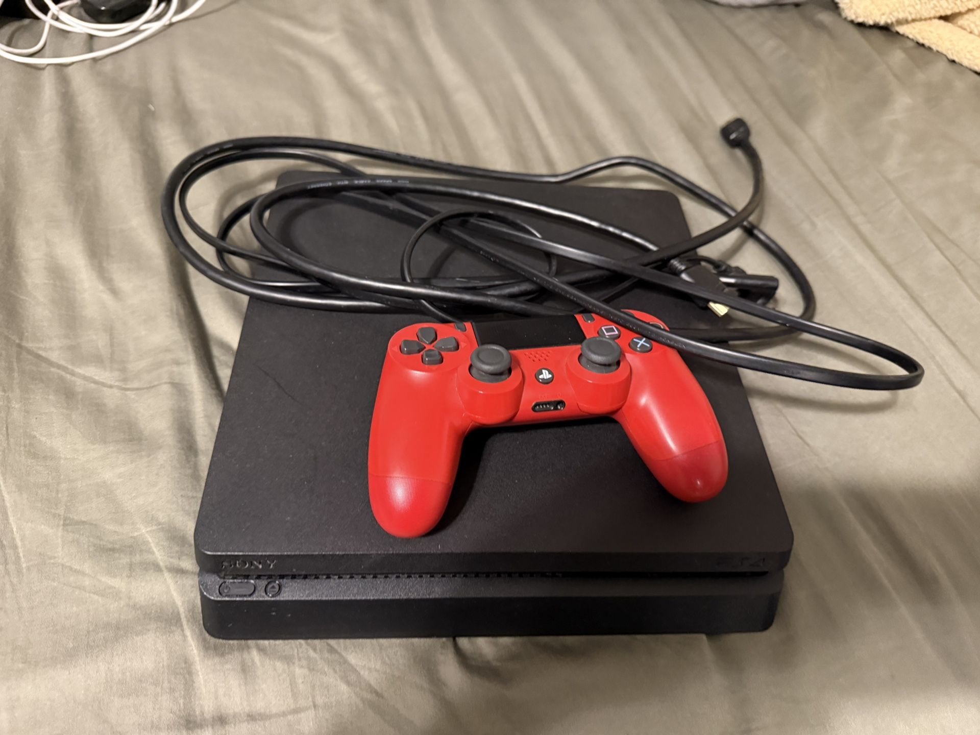 PS4 - PlayStation 4 with DualShock Controller (Free Games Included)