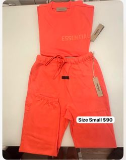 Essentials, fear of God sweatpants, and T-shirt set in the color coral