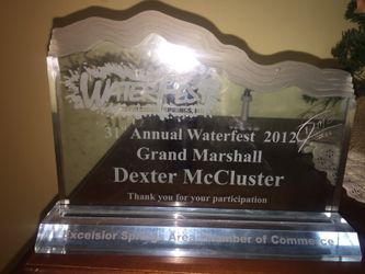 One of a kind autographed Dexter McCluster trophy.