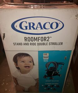 Brand new Graco stand & ride double stroller