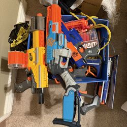 Assorted Nerf Guns With Extra Clips And Bullets