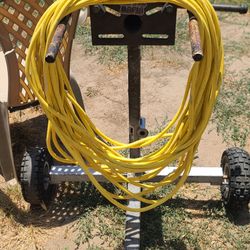 100 foot 12-3 120v  Has standard household plugs Commercial grade extension cord