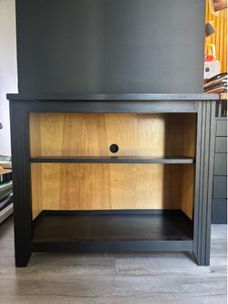 Black wooden bookshelf or shelf