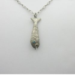 Vintage , sterling silver fish pendant with turquoise eyes