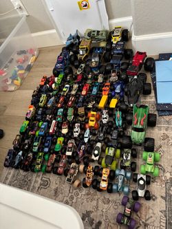 Tote full of 78 hot wheels monster trucks