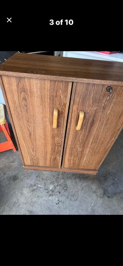 Brown cabinet with shelves 12X23.5X30 $25 Gilbert and Ray rd. Check all pics and offers.