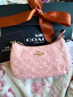 Pink denim coach