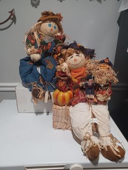 Halloween decor.  Boy and girl scarecrow.