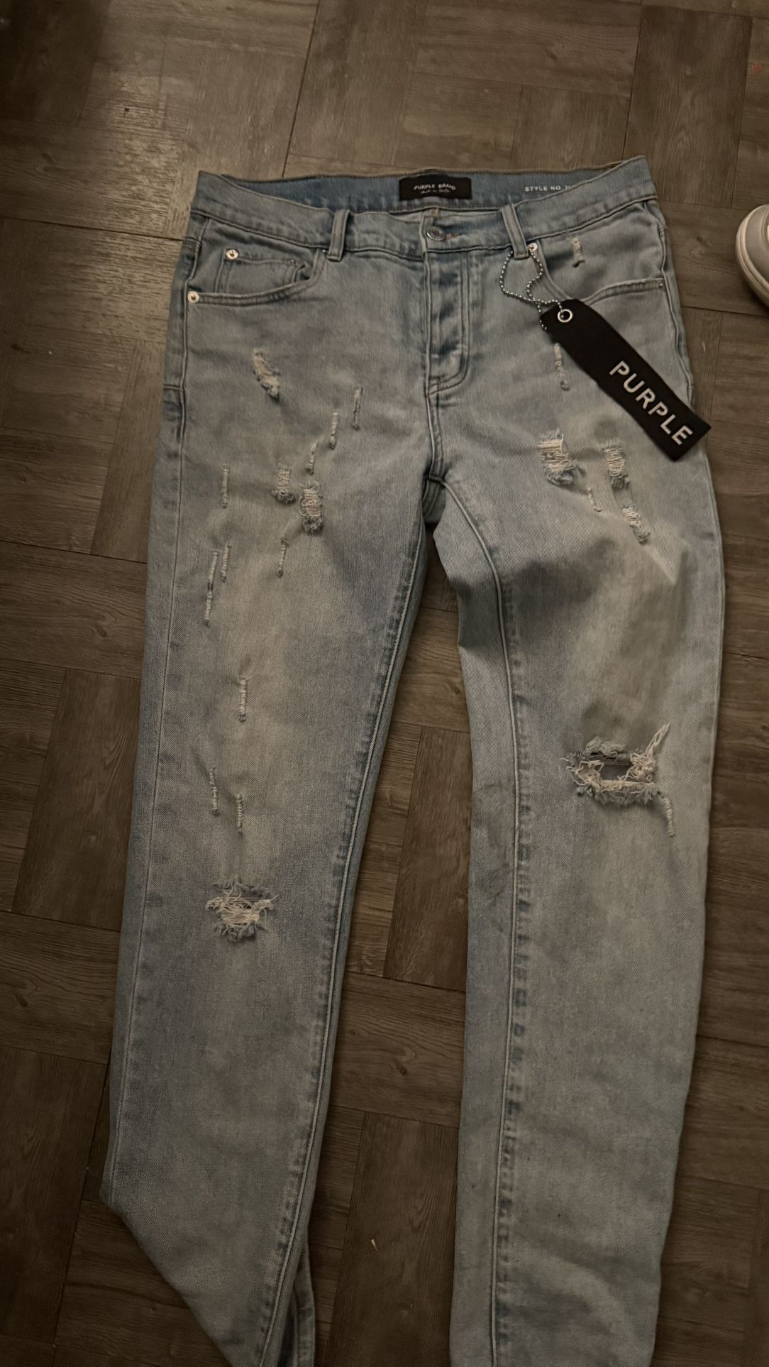 black tag purple jeans