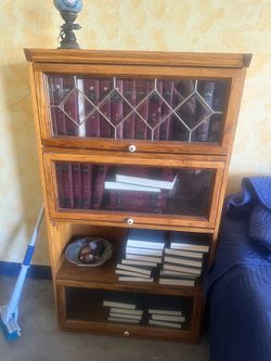 Barrister bookcase, one shelf needs repair, glass in tact, just need to secure on track