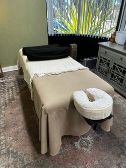 Massage Table with Boiance face rest, two bolsters, storage net, and step stool, including two eye pillows