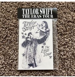 an official set of Taylor Swift The Eras Tour Postcards featuring a black-and-white design with star accents and images of Taylor Swift performing in
