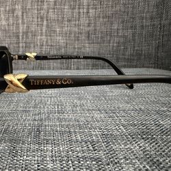 Tiffany & Co. sunglasses, specifically model TF 4023 in black with gold knot accents