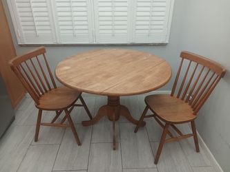 Beautiful round wood table and chairs breakfast nook