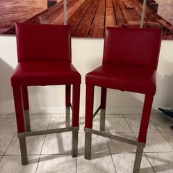 Good condition two red leather bar stools tall boys