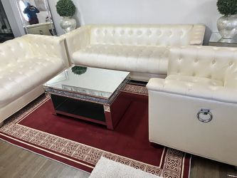 Cream Couches And Glass Table