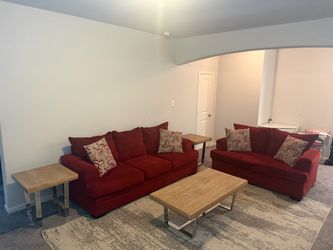 2  peace sofa with coffee and end tables