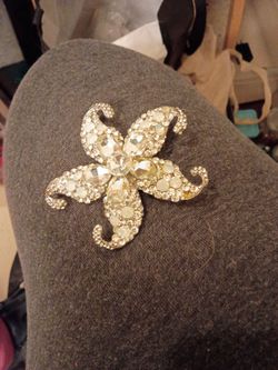 Vintage rhinestone starfish brooch with clear crystals in silver tone setting