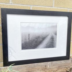 This item is a framed photographic print titled "Morning fog" by artist Paul Hansen.  Type: Black and white landscape photograph Frame: Contemporary t