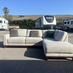Gray Living Spaces sectional sofa couch with right facing chaise