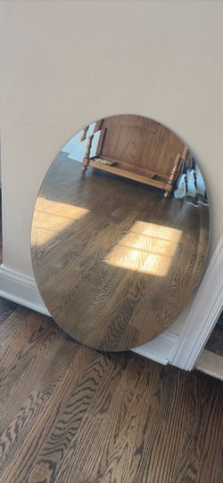Frameless oval beveled mirror with hardware