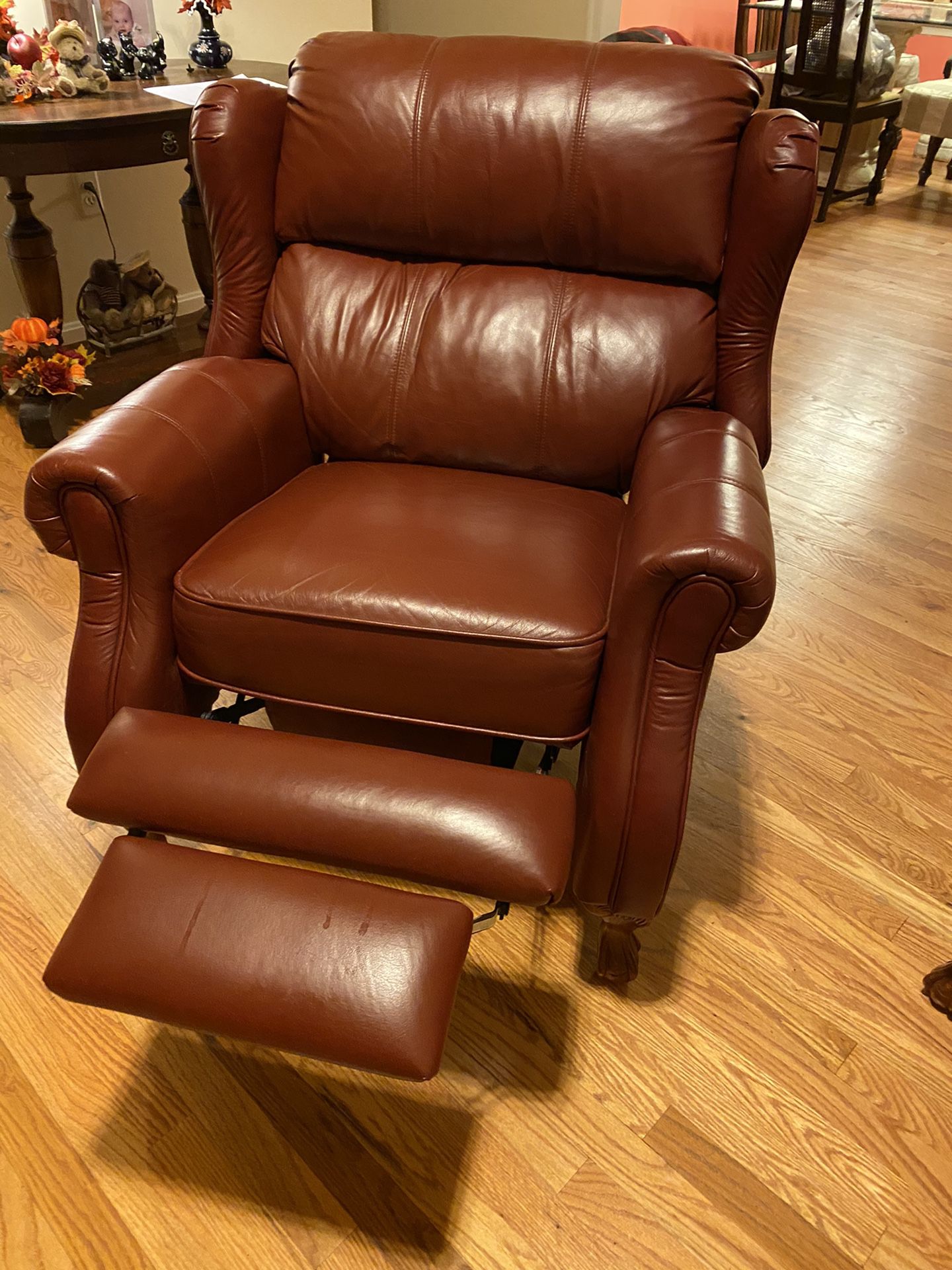 Two Dark red leather recliners