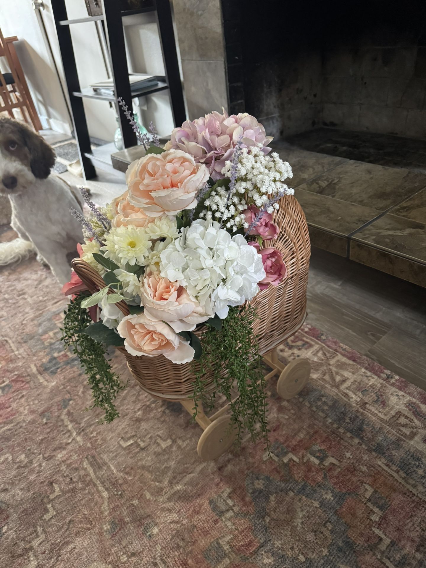 Wicker Baby Carriage With Floral Arrangement