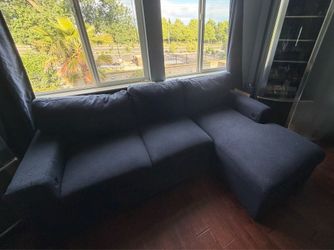 Blue couch that turns into bed