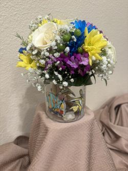 fresh Flowers With Decoration In The Vase With The Lights
