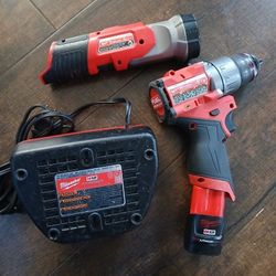 Milwaukee Impact Drill Driver Battery Charger Flashlight Tool Set 