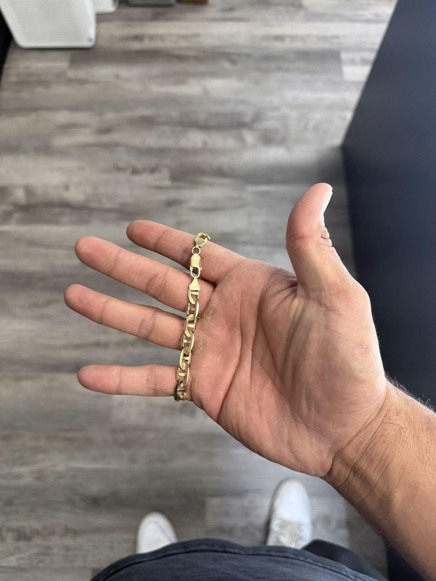 Gucci- mariner link 14k 74mm 16.5gm 9in. Bracelet 