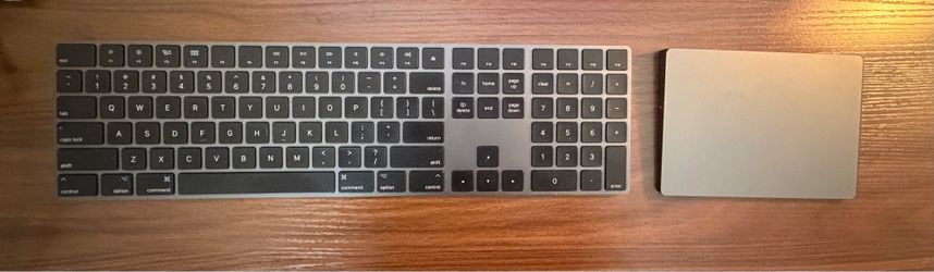 Apple Magic Keyboard and Apple track pad - black mouse and full keyboard with numerical keypad