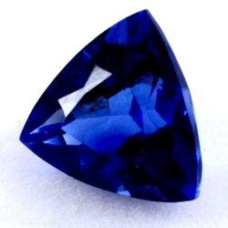 6.40 Ct Loose Dark Blue Zoisite Tanzanite-Like Excellent Trillion Cut Gemstone. The product is a 6.40 Ct loose dark blue Zoisite Tanzanite-like gemsto