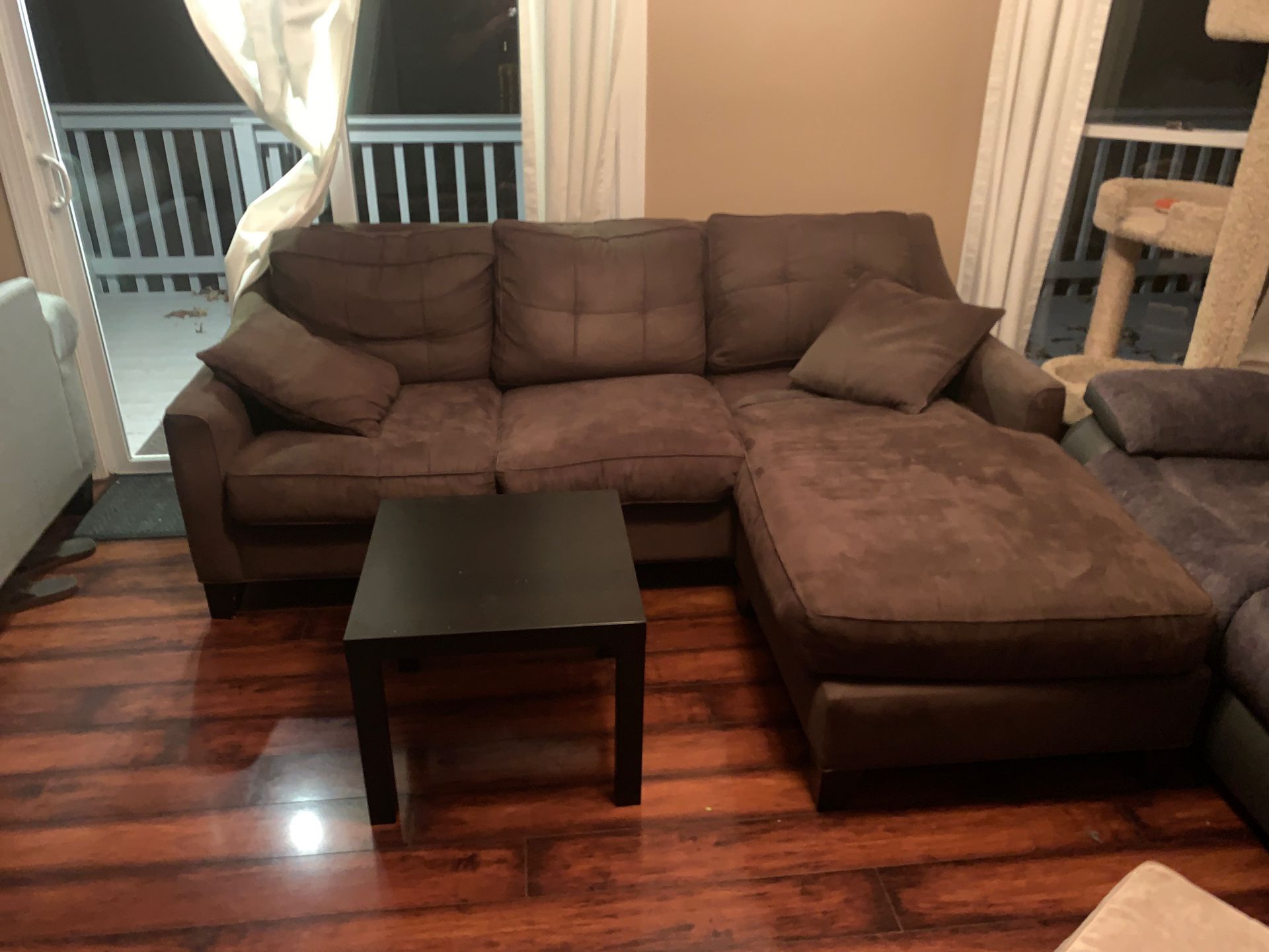 Brown Sectional Couch with Black End Table