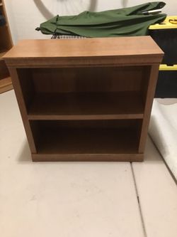 Small wooden shelf or tv stand or nightstand