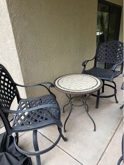 Wrought iron bar stools and table