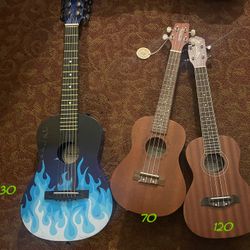 Ukulele’s For Sale Different Prices Beside